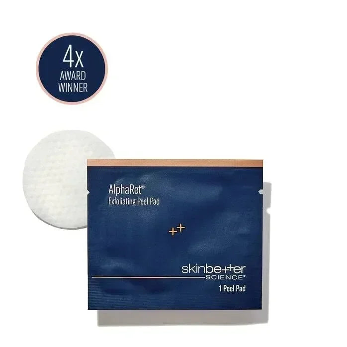 skinbetter AlphaRet Exfoliating Peel Pad foil packet beside its round cotton pad on a white background.