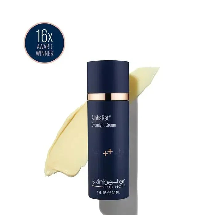 skinbetter AlphaRet Overnight Cream navy bottle with a gold band beside a smeared cream texture swatch on white.