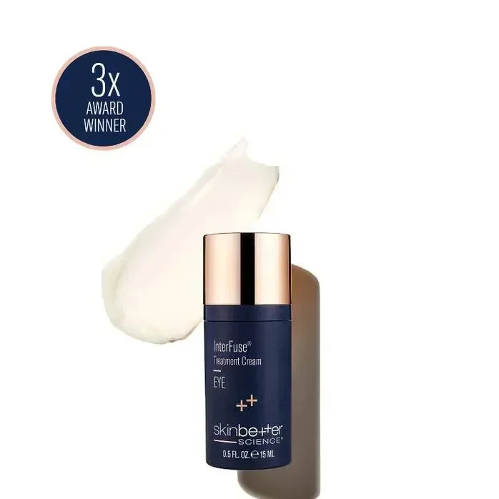 skinbetter InterFuse Treatment Cream Eye navy bottle with a gold cap beside a smeared cream texture swatch on white.