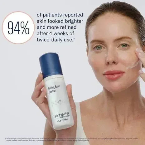 Model with skinbetter Refining Foam Cleanser lather on her cheek, holding the bottle beside a statistic graphic.
