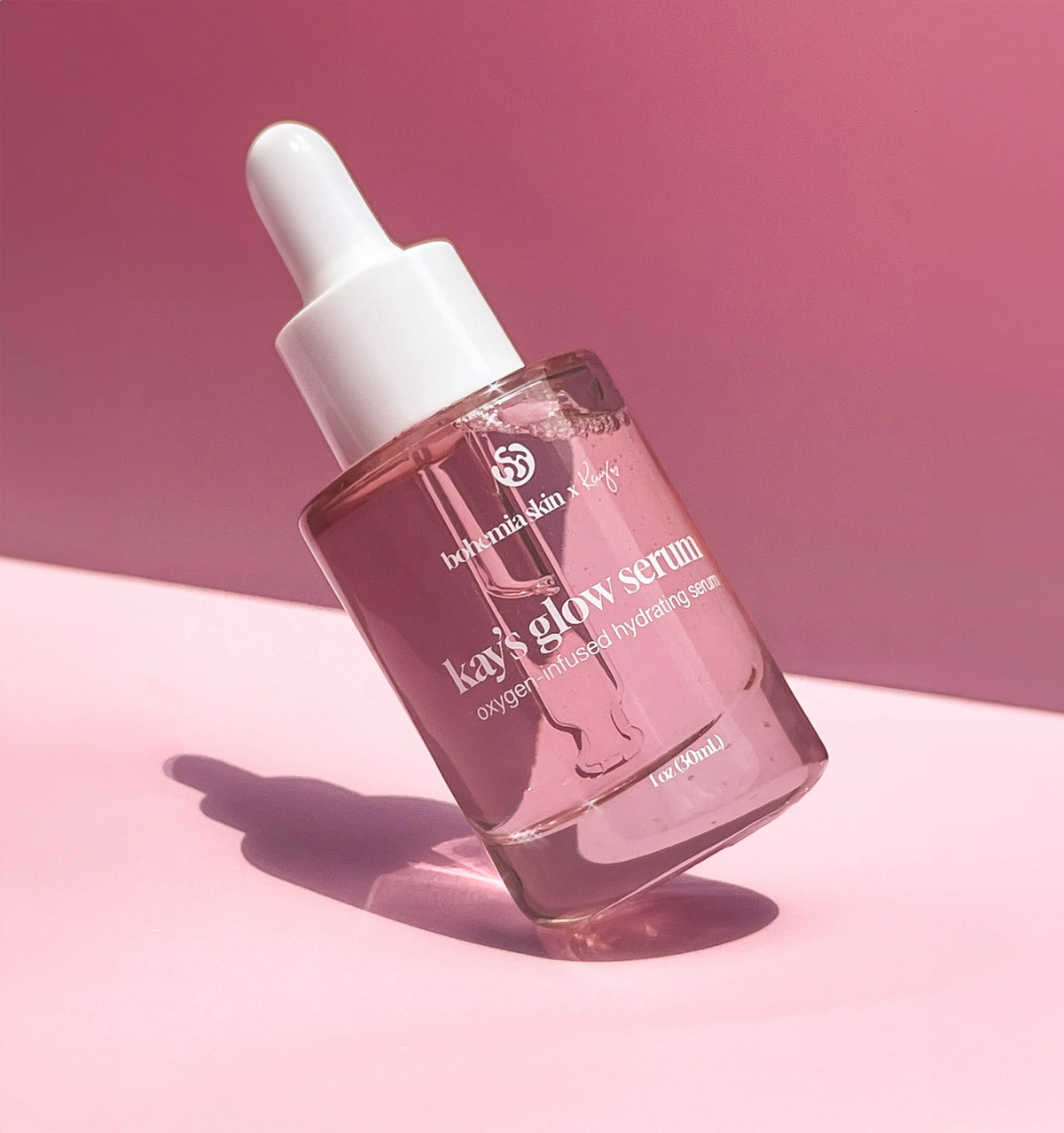 Bohemia Skin Kay's Glow Serum bottle with dropper on pink background, clean skincare product