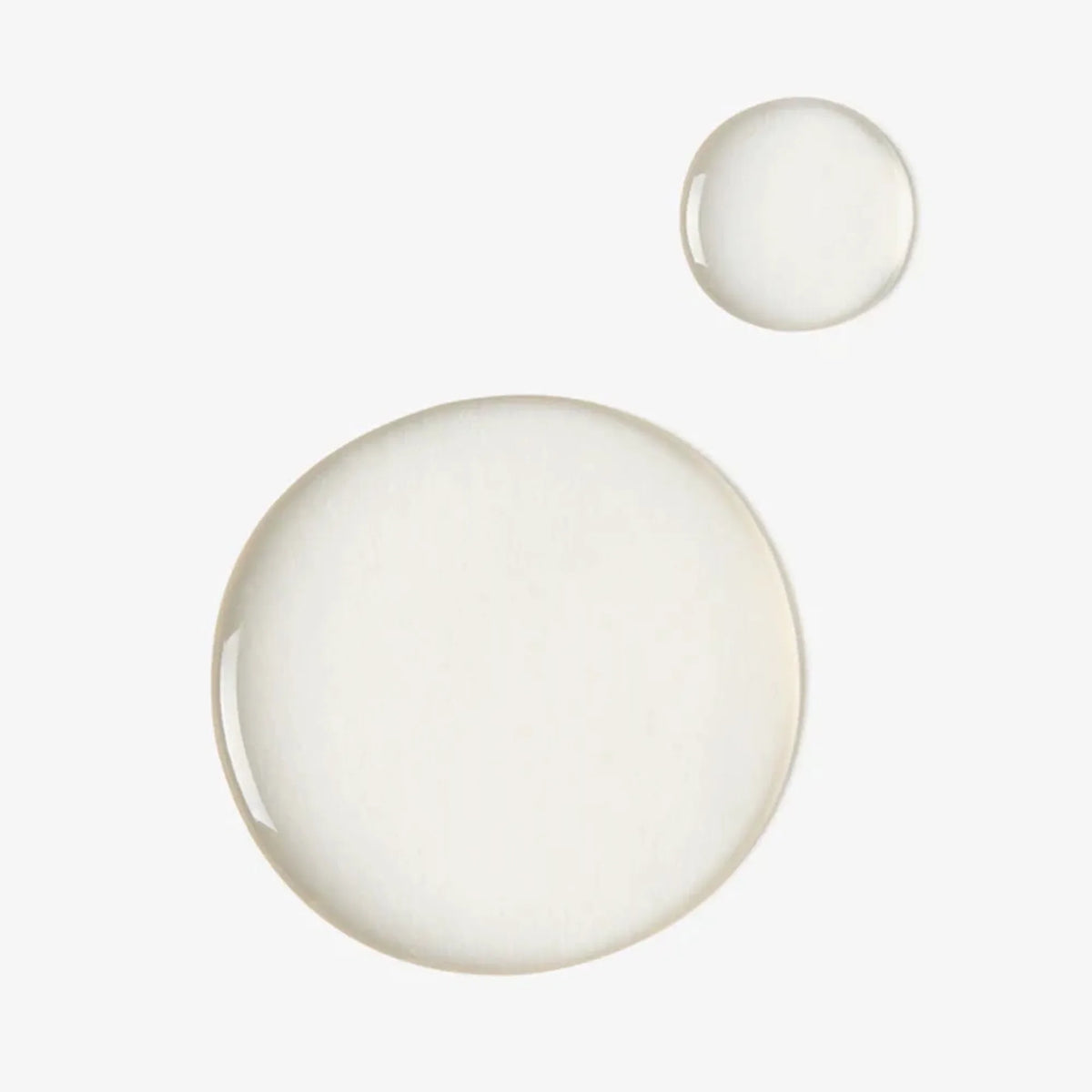 Face Reality 8 Percent L-Mandelic Serum shown as two clear liquid droplets on a white background, a texture swatch.