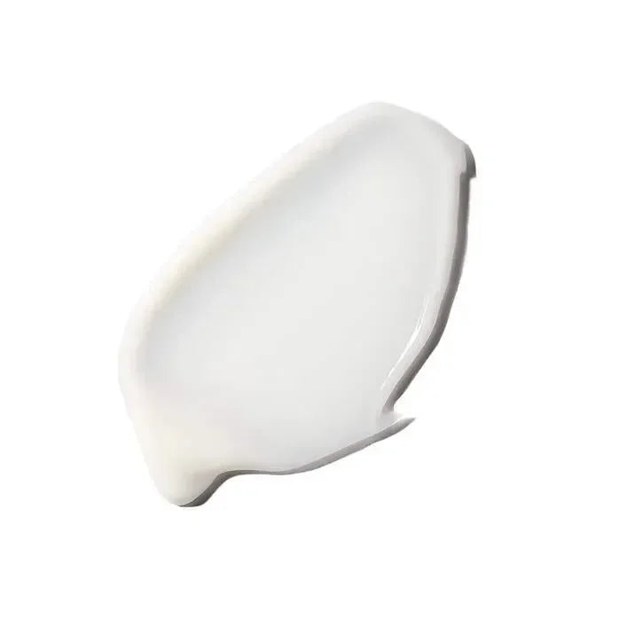Close-up of the white cream texture of skinbetter's Even Tone Correcting Serum on a plain background.